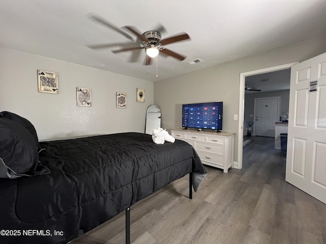 7815 Jasper Ave, Jacksonville, FL 32211 - bedroom with visible vents, wood finished floors, and a ceiling fan