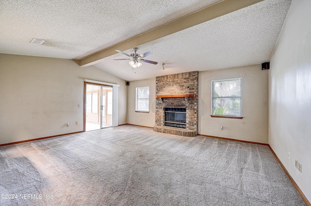 unfurnished living room featuring a textured ceiling, plenty of natural light, and ceiling fan