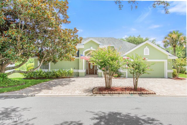 obstructed view of property featuring a garage