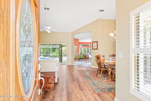 interior space with hardwood / wood-style flooring, lofted ceiling, and ceiling fan