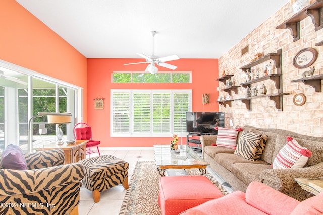 tiled living room with brick wall and ceiling fan