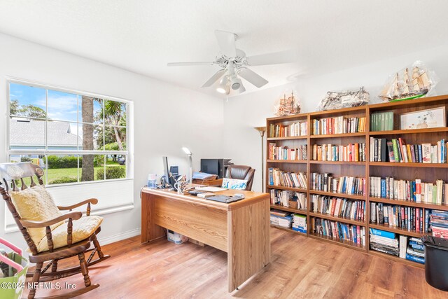 office area with light hardwood / wood-style floors