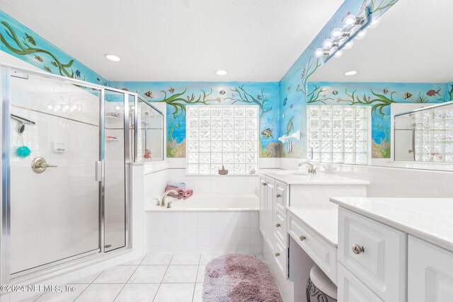 bathroom with separate shower and tub, tile patterned floors, and vanity