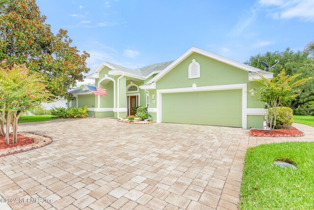 view of front of property with a garage