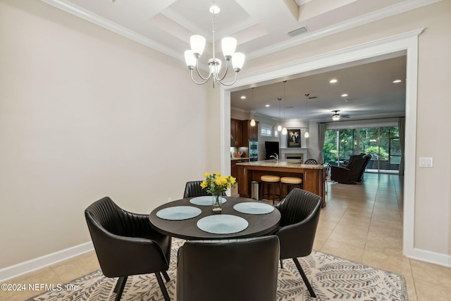 dining space featuring light tile patterned floors, crown molding, and a chandelier