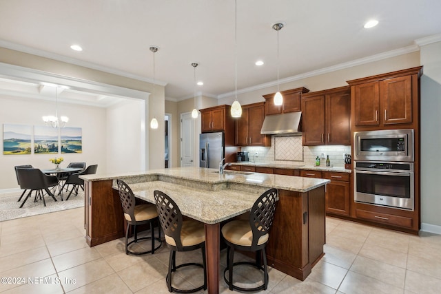 kitchen featuring stainless steel appliances, a large island with sink, light tile patterned floors, an inviting chandelier, and hanging light fixtures