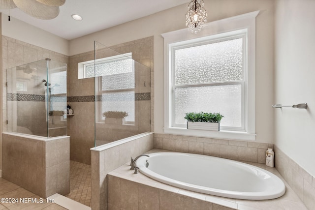 bathroom with tile patterned flooring and plus walk in shower