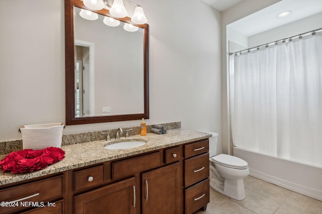 full bathroom featuring tile patterned floors, vanity, toilet, and shower / bath combo with shower curtain