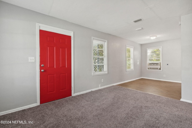 foyer featuring carpet floors