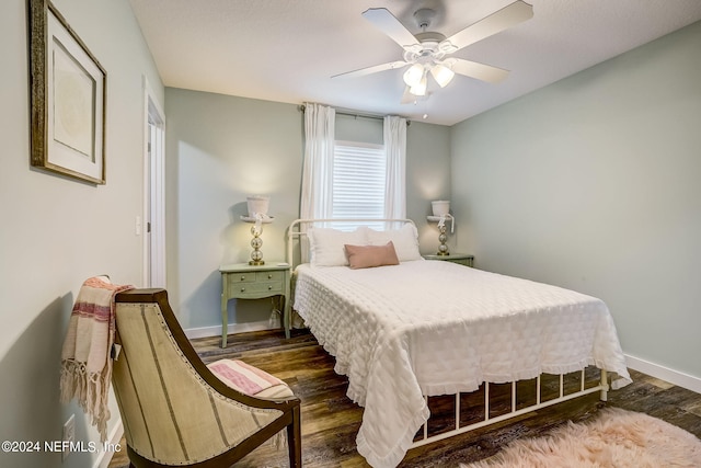 bedroom with ceiling fan and wood-type flooring