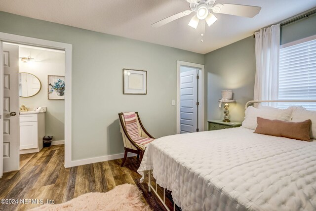 bedroom with ceiling fan and dark wood-type flooring