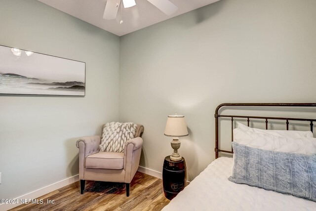 bedroom featuring wood-type flooring and ceiling fan