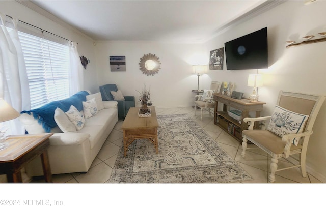 living room featuring tile patterned floors and crown molding