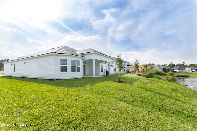 view of property exterior with a lawn