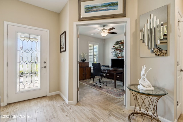 entryway featuring ceiling fan