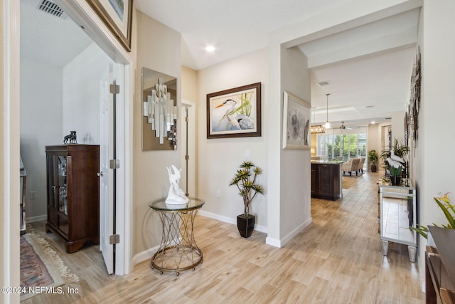 hall with light wood-type flooring