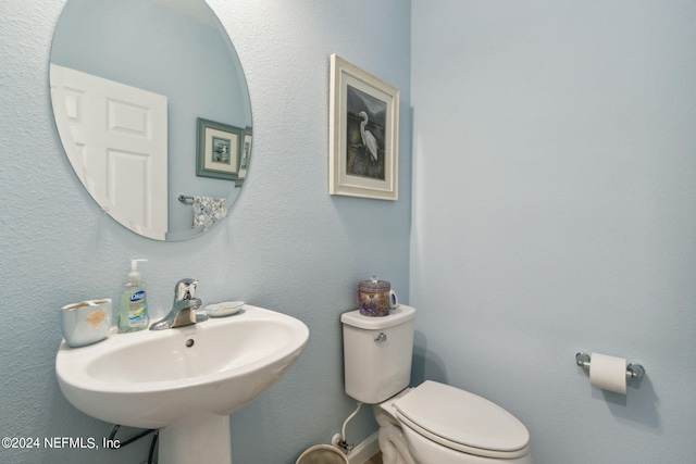 bathroom with sink and toilet