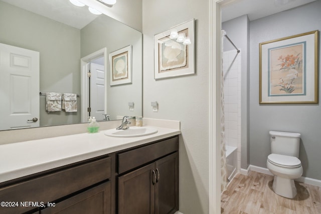 full bathroom featuring vanity, tub / shower combination, wood-type flooring, and toilet