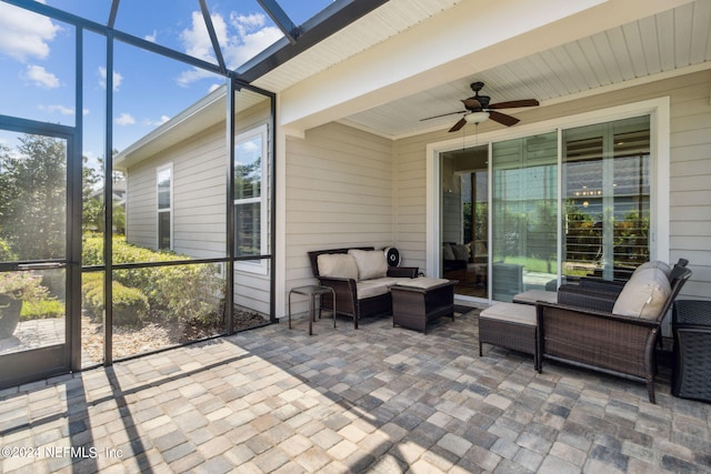 sunroom with ceiling fan