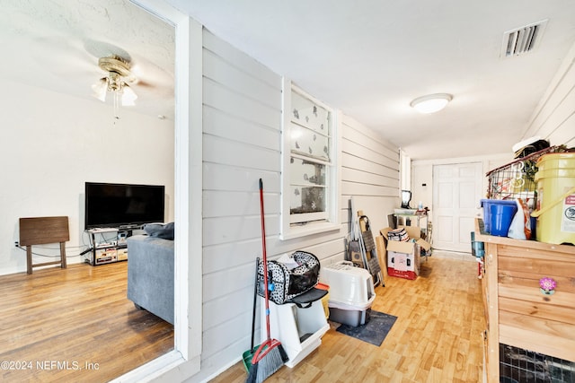 interior space with ceiling fan