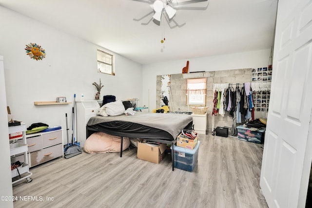 bedroom featuring light hardwood / wood-style floors and ceiling fan