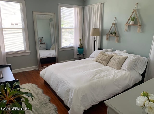 bedroom featuring dark wood-type flooring