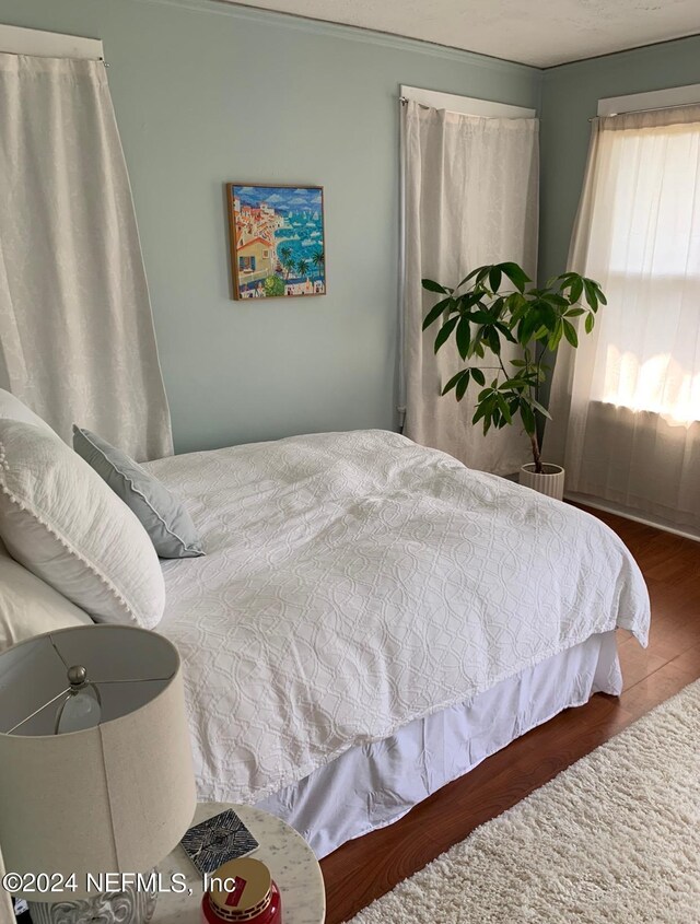 bedroom featuring hardwood / wood-style floors