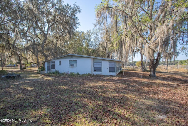 view of side of property featuring cooling unit