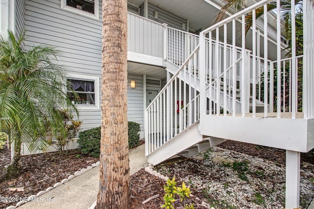 view of property exterior featuring stairway