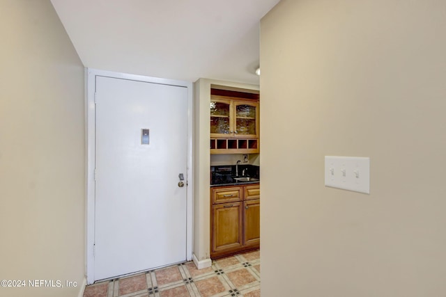 interior space with light floors and a sink