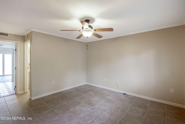 tiled empty room featuring ceiling fan and ornamental molding