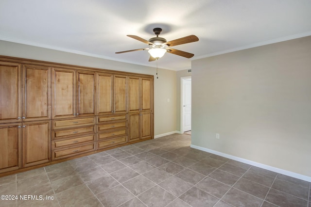 unfurnished bedroom with crown molding, ceiling fan, and baseboards