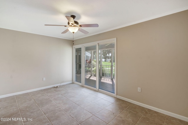 tiled spare room with ceiling fan and crown molding