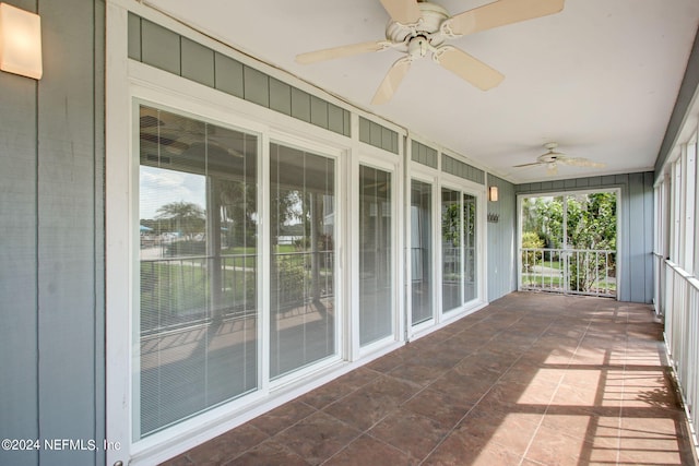 exterior space with ceiling fan