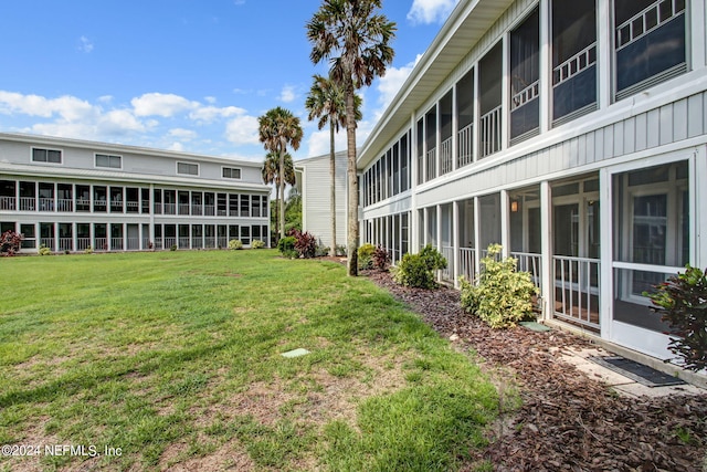 view of yard featuring a sunroom