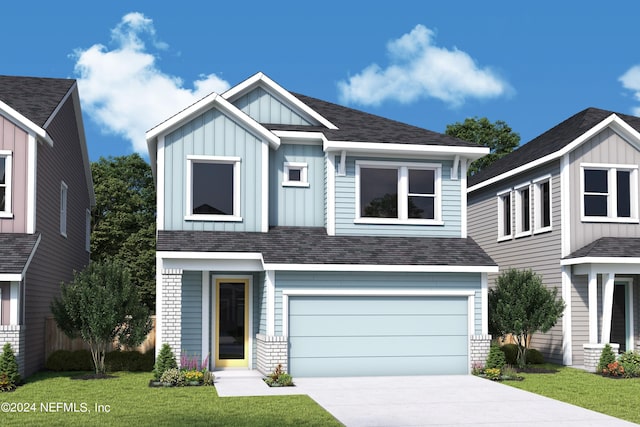 view of front of house with a garage and a front yard