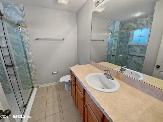 bathroom with vanity, an enclosed shower, tile patterned floors, and toilet