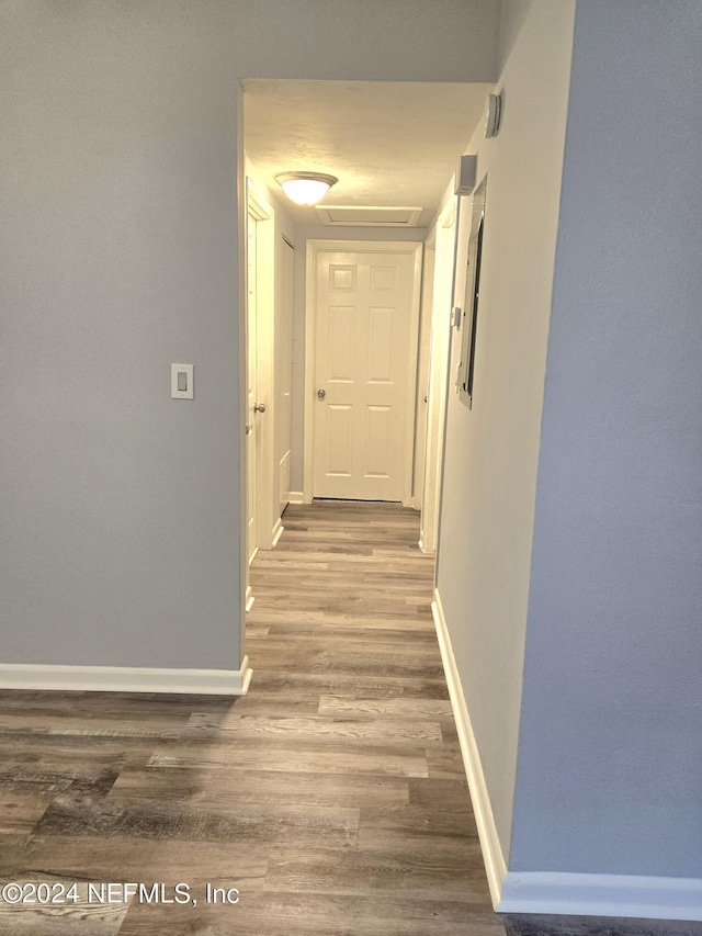 hallway featuring hardwood / wood-style floors