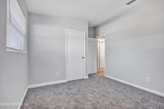 empty room with carpet flooring