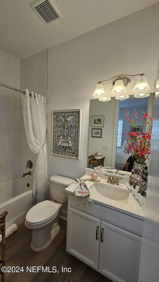 full bathroom with toilet, vanity, shower / bath combination with curtain, and hardwood / wood-style flooring