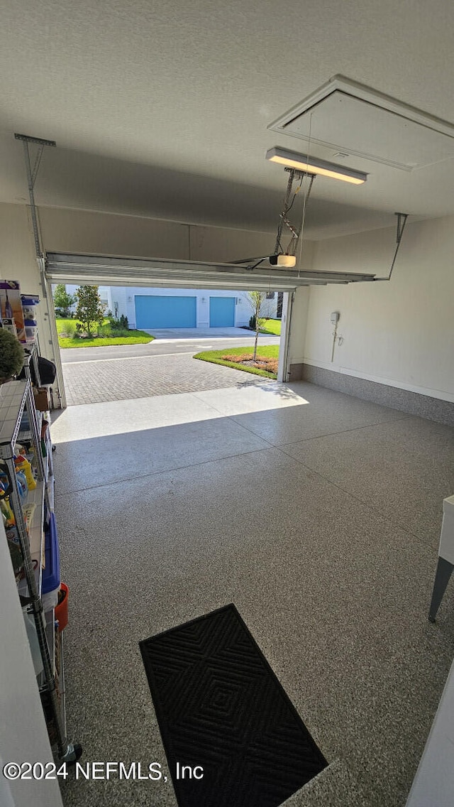 garage featuring a garage door opener