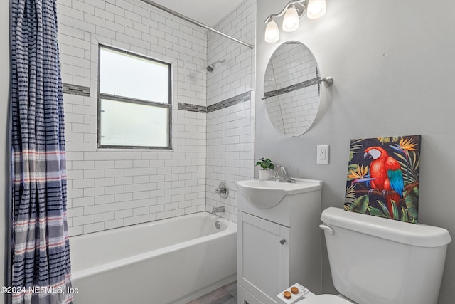 full bathroom with vanity, toilet, and shower / bathtub combination with curtain