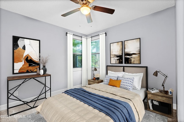 carpeted bedroom featuring ceiling fan