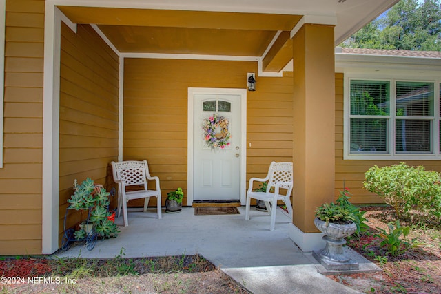 doorway to property featuring a porch