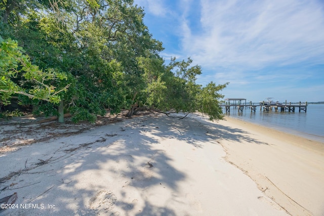 exterior space with a beach view and a water view