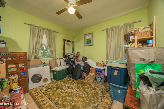 washroom with ceiling fan and light hardwood / wood-style floors