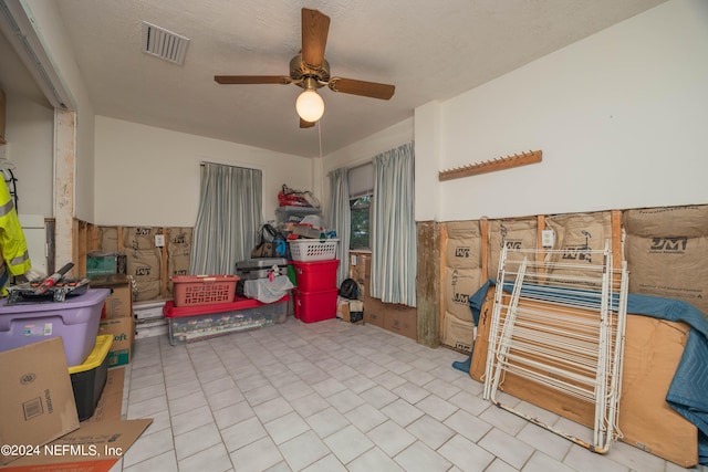 storage area featuring ceiling fan