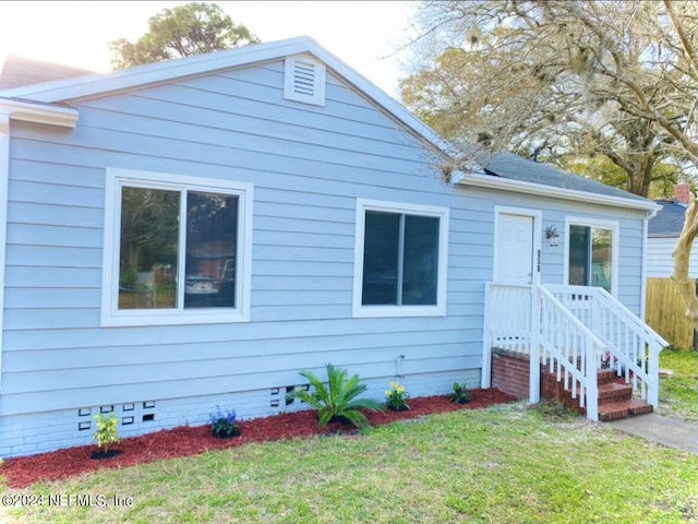 bungalow with a front lawn