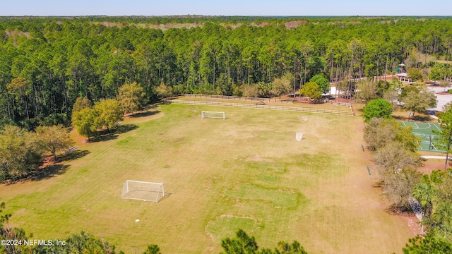 aerial view with a wooded view and a rural view