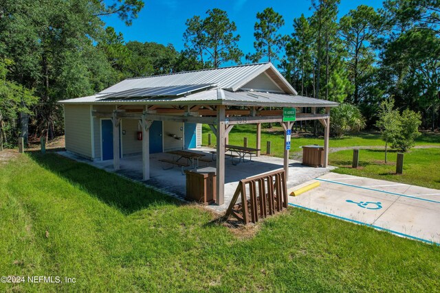 view of home's community with a patio area, a yard, and a gazebo